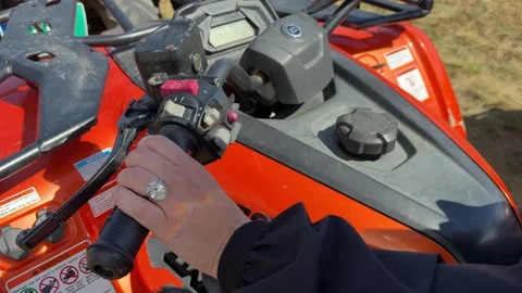 Landscape video of oval diamond ring on ATV throttle in motion Stock Footage 319402671