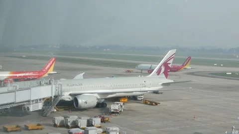 Landscape view to airplane plane parking to do ground service operation at .. Video stock 340309888
