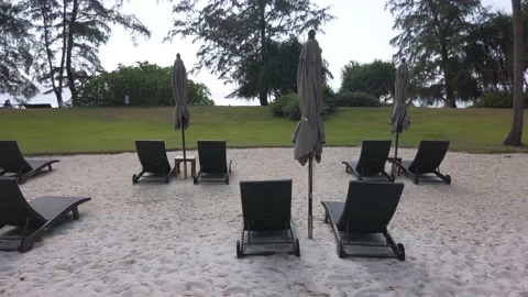 Landscape view of bench chair on the beach in summer sunset daytime Stock Footage 149199096