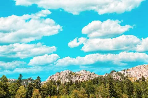 Landscape. View of the blue sky with clouds, mountain range and forest. Copy  Stock Photos