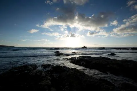 A landscape view of Broad Haven beach at dusk and sunset in Broad Haven, Pemb Stock Photos