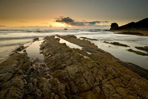 A landscape view of Broad Haven beach at dusk and sunset in Broad Haven, Pemb Stock Photos