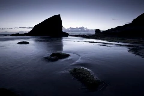 A landscape view of Broad Haven beach at dusk and sunset in Broad Haven, Pemb Stock Photos