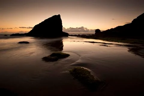 A landscape view of Broad Haven beach at dusk and sunset in Broad Haven, Pemb Stock Photos