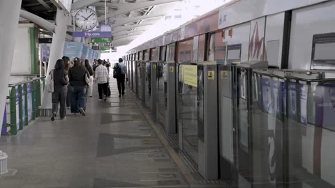 Landscape view of BTS skytrain platform train station while train leaving f.. Stock Footage 326625994