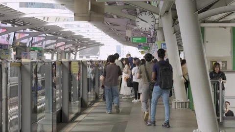 Landscape view of BTS skytrain platform train station full with crowded of .. Stock Footage 335577086