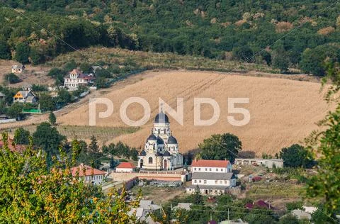 Landscape view with Capriana Monastery and the village around Stock Photos