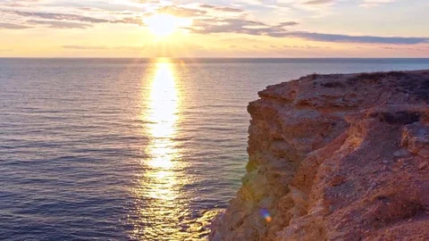 Landscape view on cliff in the sea during sunset Stock Footage 75274427