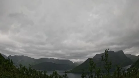 Landscape view of dramatic overcast cloudy sky over mountain fjord in Norway Vídeo Stock 342059360