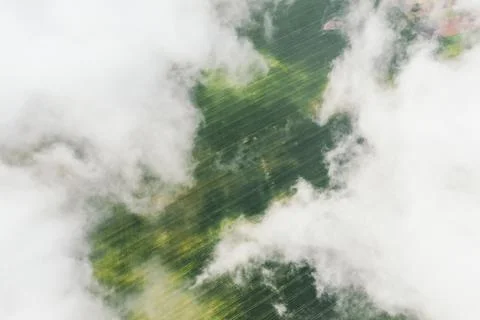Landscape view from drone, green fields, sky with white clouds. Video from a Stock Photos