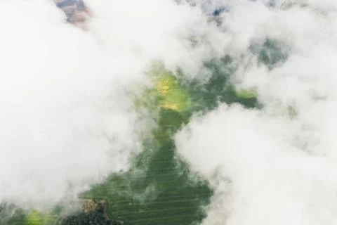 Landscape view from drone, green fields, sky with white clouds. Stock Photos
