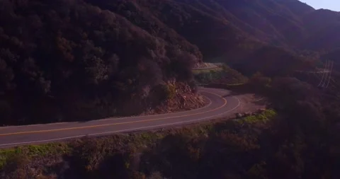 Landscape view of empty winding mountain road Stock Footage 136338895