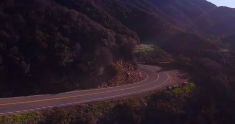 Landscape view of empty winding mountain road Stock Footage 136340454