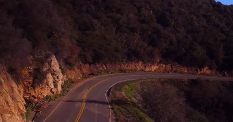 Landscape view of empty winding mountain road Stock Footage 136340510