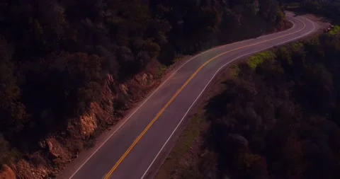 Landscape view of empty winding mountain road Stock Footage 136340688