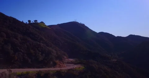 Landscape view of empty winding mountain road Stock Footage 136340744