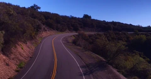 Landscape view of empty winding mountain road Stock Footage 136341252