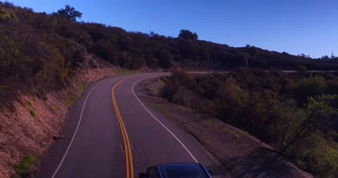 Landscape view of empty winding mountain road Stock Footage 136341263