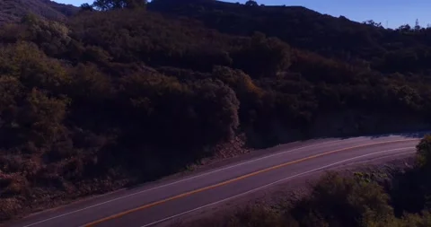 Landscape view of empty winding mountain road Stock Footage 136341336