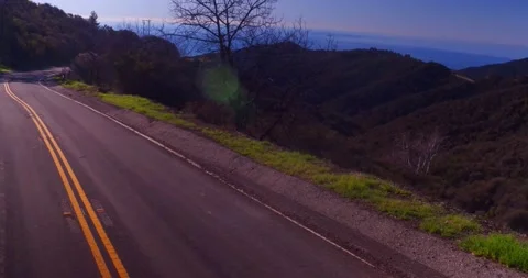 Landscape view of empty winding mountain road Stock Footage 136341592