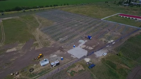 Landscape view of the field with the construction of a solar power station Stock Footage 160812309