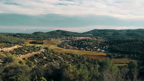 Landscape view of fields and countryside, between the green mountains Landscapes Stock Footage 171190856