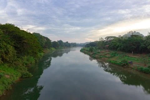 Landscape view of forest river trees with cloudy in morning Stock Photos