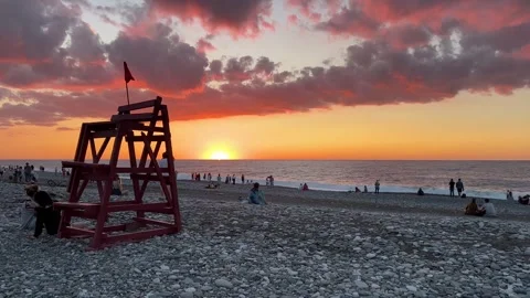 Landscape with view of horizon, waves, pebble beach, sunset Stock Footage 255388456