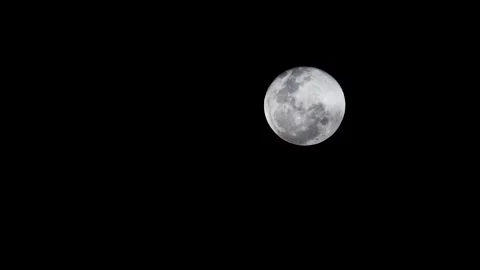 Landscape view of a illuminated grey full moon with lunar craters still in a Vídeos de archivo 345185550