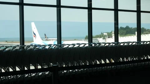 Landscape view from inside departure terminal hall area to outside at aircr.. Stock Footage 248961862