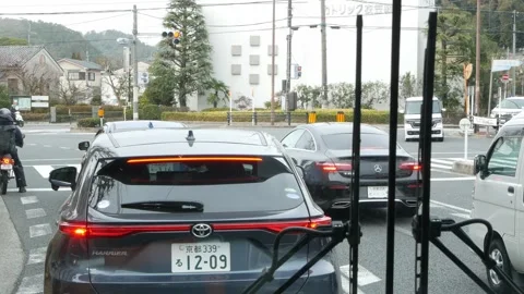 Landscape view at intersection of Kyoto local area while bus and cars waiti.. Stock Footage 320448278