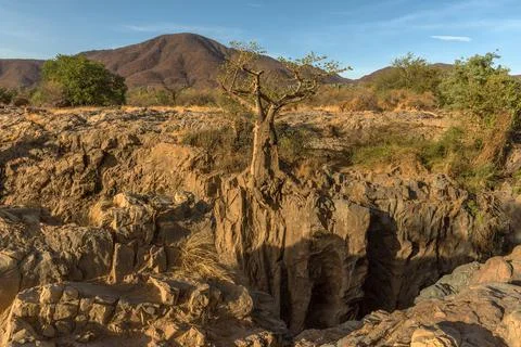 Landscape view of the Kunene River, the border river between Namibia-Angola Stock Photos