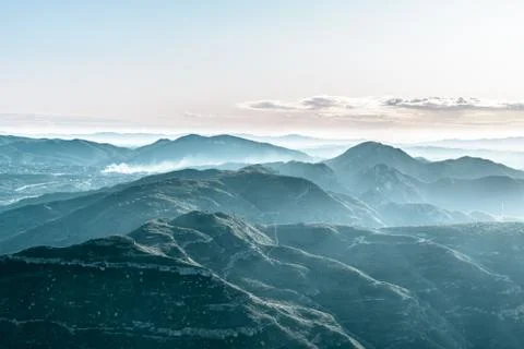 Landscape with view of misty mountains from Montserrat peak in Catalonia Stock Photos