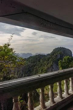 Landscape view on mountains and fields with vegetation, from an old rusty b.. Stock Photos