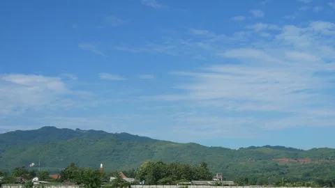 Landscape view of mountains or hills with clear blue sky Stock Footage 306779940