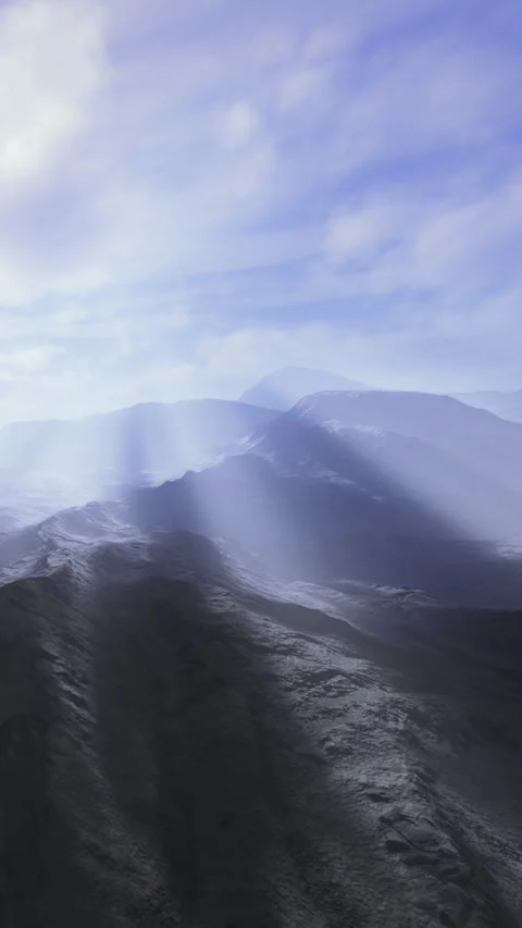Landscape view of mountains under blue sky with light shining through clouds Stock Footage 334881944