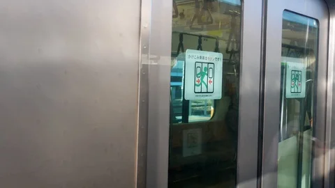 Landscape view from the moving train with another train while leaving Stock Footage 119267358