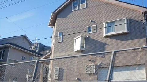 Landscape view from the moving train with view of the housing habitant area Stock Footage 119267295