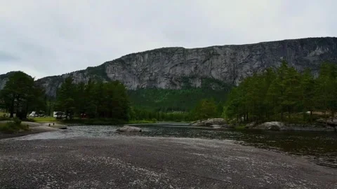 Landscape view of a river and mountain in Norway during a cloudy day in lat.. Stock Footage 340207490