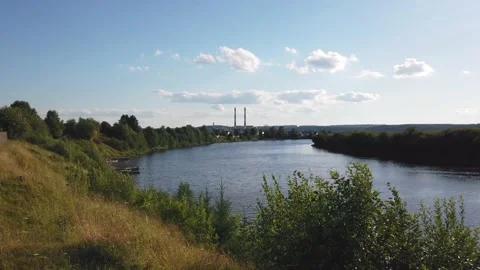 Landscape view with river and sky at sunset. City on the horizon Video stock 137857597