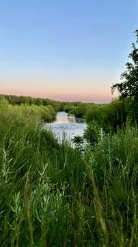A landscape with a view of the river and the sunset Stock Photos