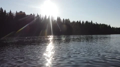 Landscape view of the river at sunset in motion. Reflection of sun Stock-Footage 137866974