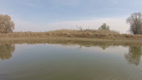 Landscape view of riverside from the moving boat. 库存影片 99722737