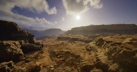 Landscape view of rocky terrain under a bright sky at sunset Stock Illustration