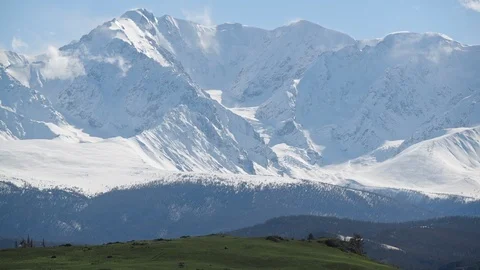 Landscape view: snow-capped altai mountain peaks with forest hills on foothills. Stock Footage 103108696
