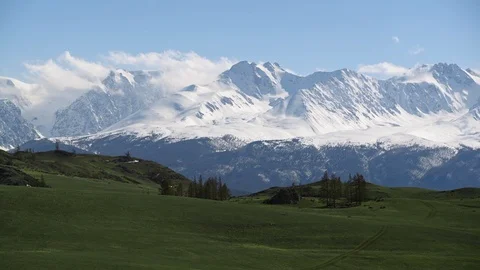 Landscape view: snow-capped altai mountain peaks with barren hills on foothills. Stock Footage 103109278