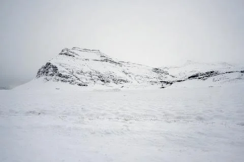 Landscape view of snow covered fields and mountains in Iceland. Nature, tra.. Stock Photos