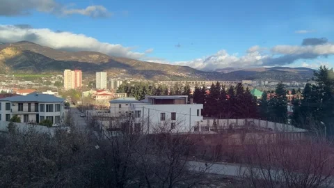 Landscape view of Tbilisi mountains, clouds, blue sky, suburban residential area Stock Footage 298701770