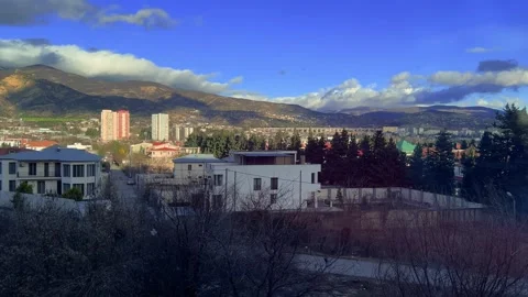 Landscape view of Tbilisi mountains, clouds, blue sky, suburban residential area Stock Footage 298706448