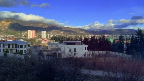 Landscape view of Tbilisi mountains, clouds, blue sky, suburban residential area Stock Footage 329668877